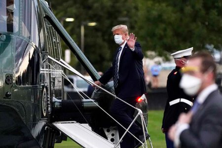 Donald Trump boarding an aircraft